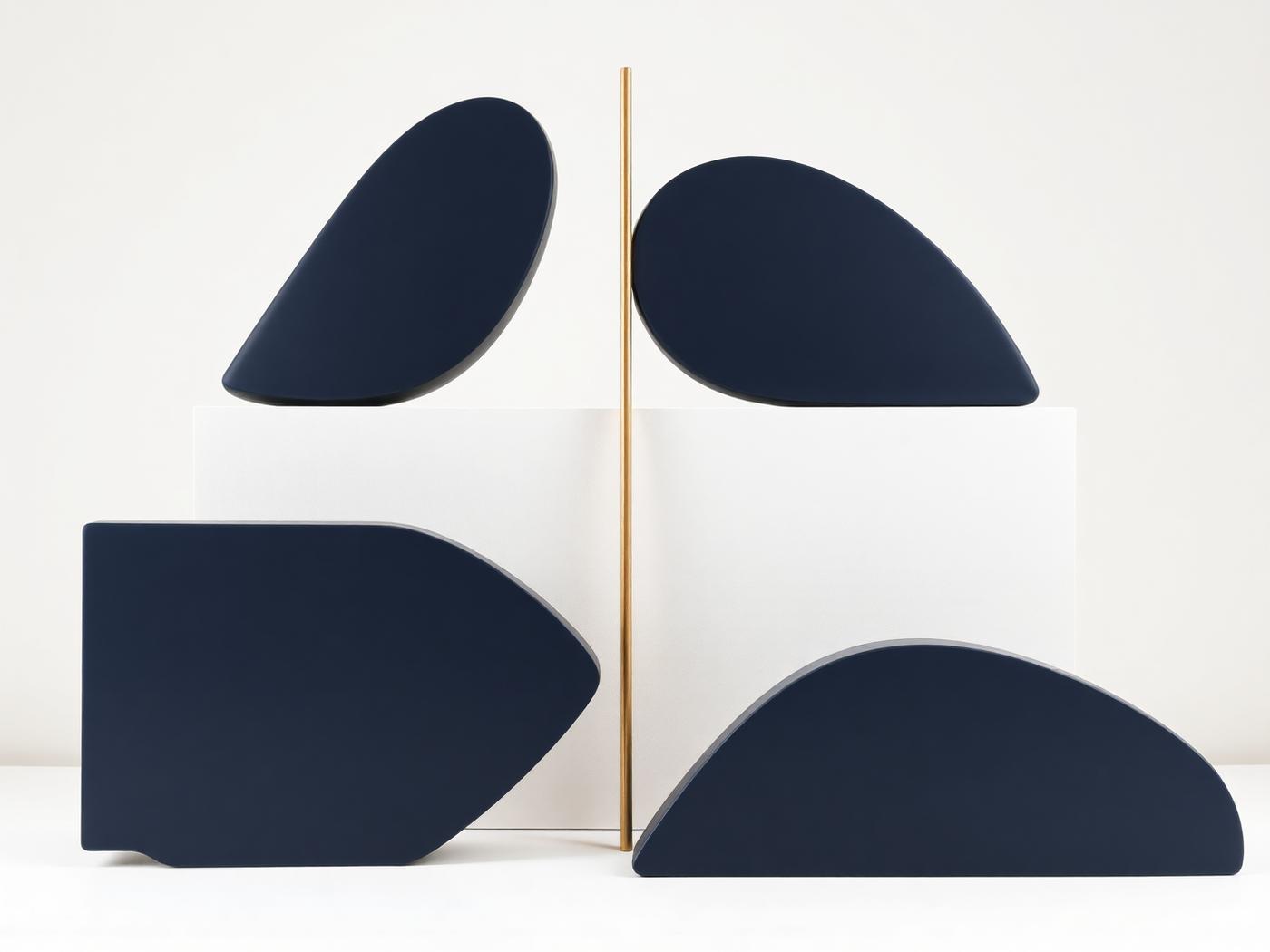 Differently shaped navy forms aligning along a single gold axis